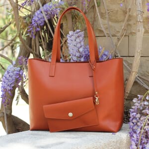 posed view of the jules &amp; jenn brick leather tote bag